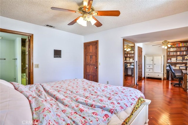 bedroom featuring a textured ceiling, ceiling fan, and dark parquet floors