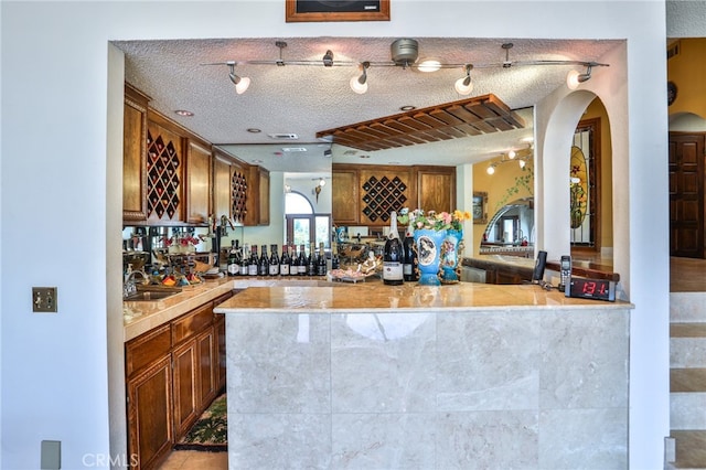 interior space featuring a textured ceiling and sink