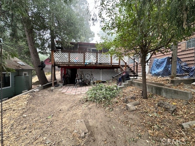 rear view of property with a deck