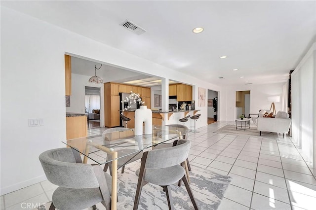 dining room featuring light tile patterned floors