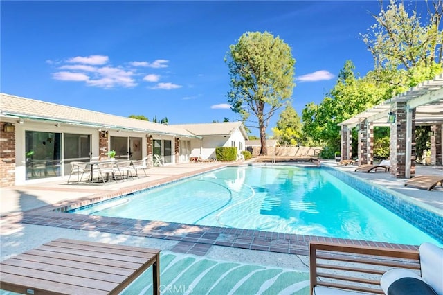 view of swimming pool with a pergola and a patio area