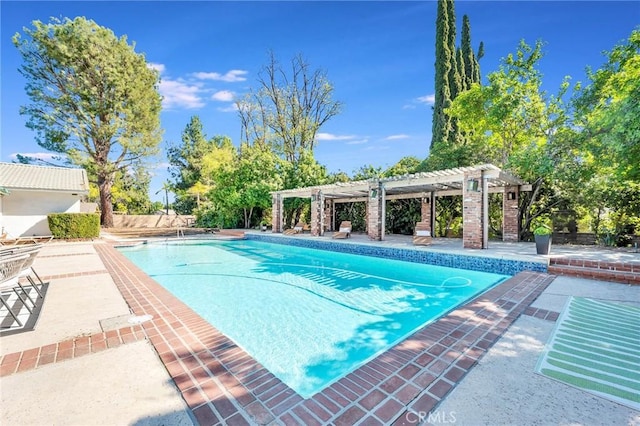 view of pool with a pergola and a patio