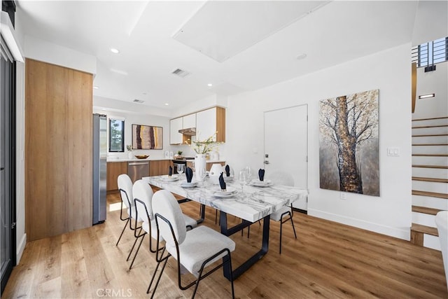 dining room featuring light hardwood / wood-style flooring