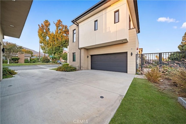 view of property exterior with a garage