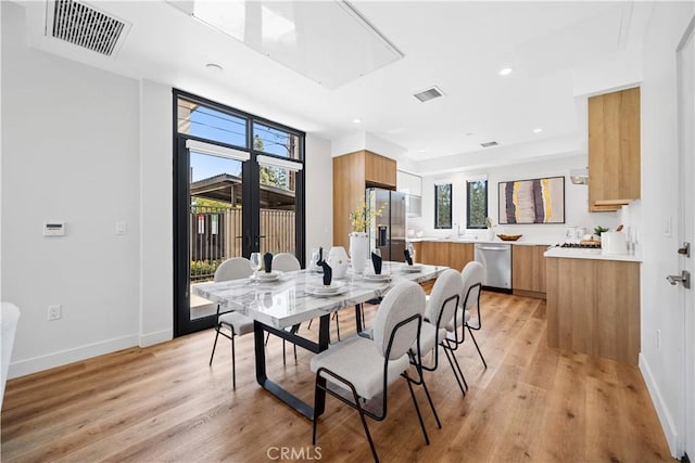 dining room featuring light hardwood / wood-style flooring