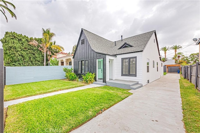 2942 S W View St, Los Angeles, CA 90016 - view of front of property featuring a shingled roof, concrete driveway, and board and batten siding