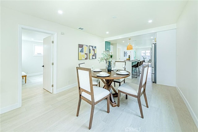 2942 S W View St, Los Angeles, CA 90016 - dining space featuring light wood-style flooring, healthy amount of natural light, recessed lighting, and baseboards