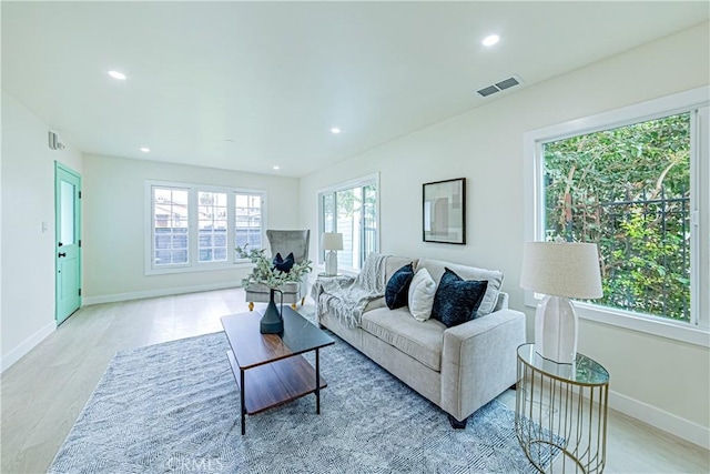 2942 S W View St, Los Angeles, CA 90016 - living area featuring light wood-type flooring, baseboards, and recessed lighting