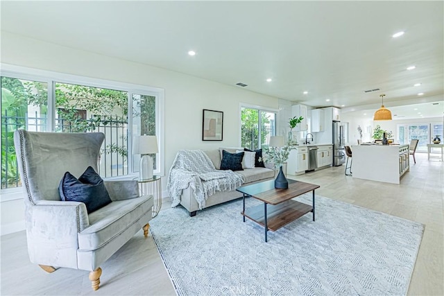 2942 S W View St, Los Angeles, CA 90016 - living area with recessed lighting and light wood finished floors