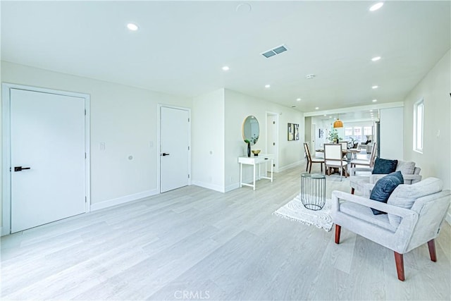 2942 S W View St, Los Angeles, CA 90016 - living area with light wood-style flooring, recessed lighting, and baseboards