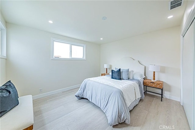 2942 S W View St, Los Angeles, CA 90016 - bedroom with light wood-type flooring, baseboards, and recessed lighting