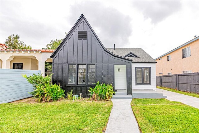 2942 S W View St, Los Angeles, CA 90016 - view of front of property with board and batten siding