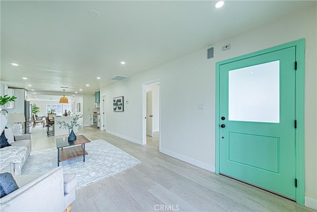 2942 S W View St, Los Angeles, CA 90016 - living room featuring recessed lighting, light wood finished floors, and baseboards