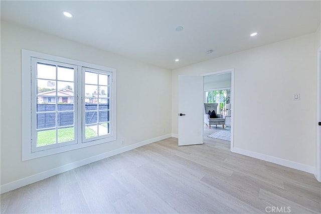 2942 S W View St, Los Angeles, CA 90016 - spare room with light wood-style floors, recessed lighting, and baseboards