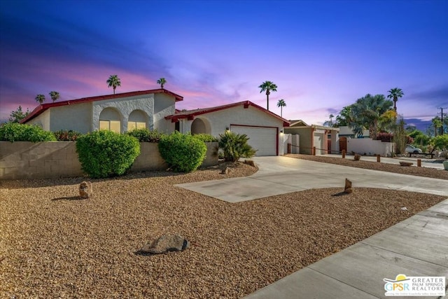 view of front of property with a garage