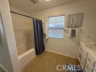 bathroom featuring shower / bath combination with curtain and vanity