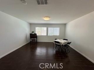 unfurnished dining area with dark hardwood / wood-style floors