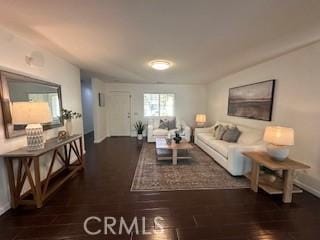 living room featuring dark wood-type flooring