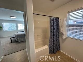 bathroom featuring shower / bath combo with shower curtain