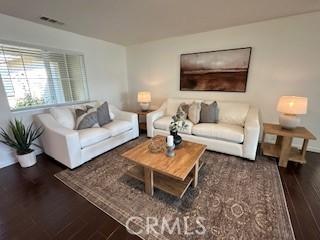 living room with dark hardwood / wood-style floors