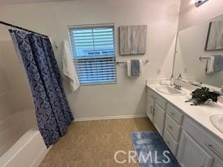 bathroom featuring vanity and shower / tub combo