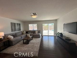 living room with dark hardwood / wood-style floors