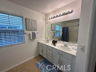 bathroom with a shower with curtain and vanity