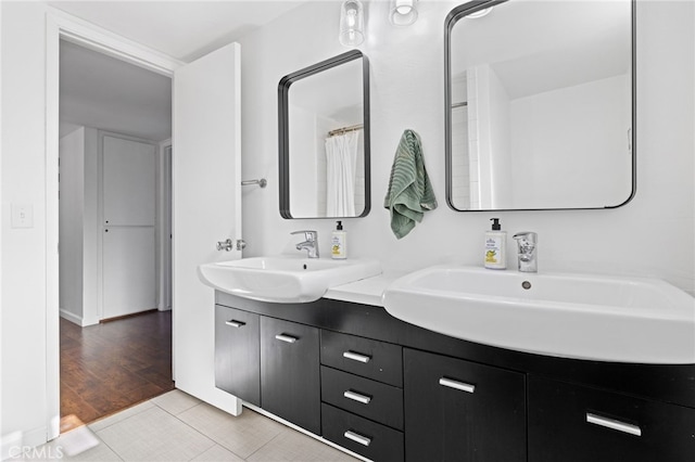 bathroom with vanity and hardwood / wood-style flooring