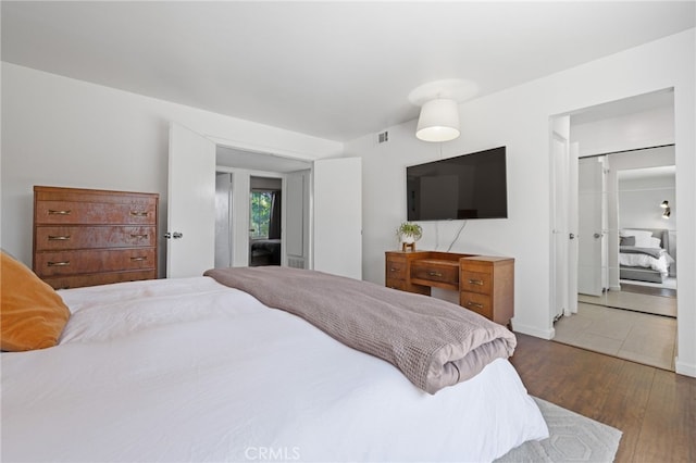 bedroom featuring dark hardwood / wood-style floors