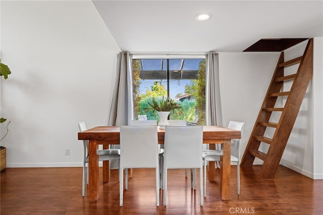 dining space with dark hardwood / wood-style floors