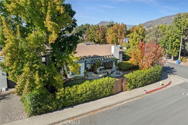 birds eye view of property with a mountain view