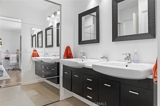 bathroom with vanity and hardwood / wood-style flooring