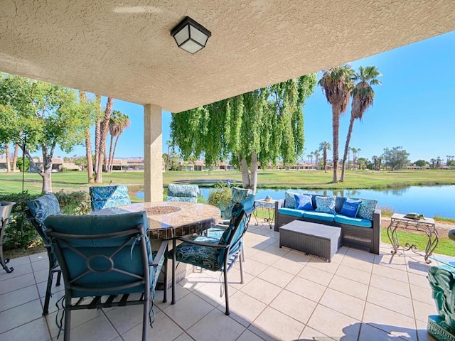 view of patio featuring an outdoor living space and a water view