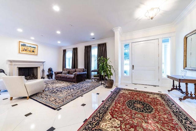 tiled foyer featuring ornamental molding