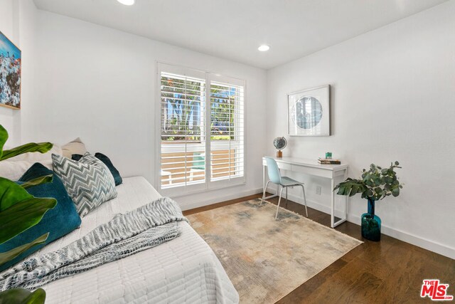 bedroom featuring dark hardwood / wood-style floors