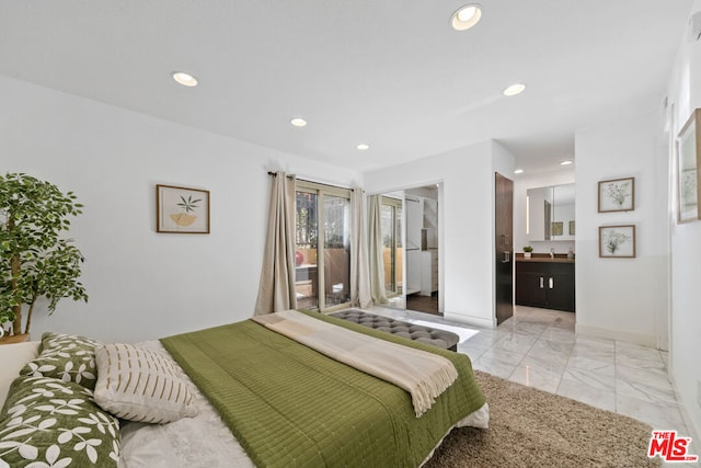 bedroom featuring ensuite bath