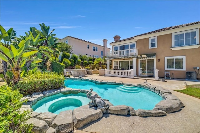 view of swimming pool featuring an in ground hot tub, central AC, and a patio