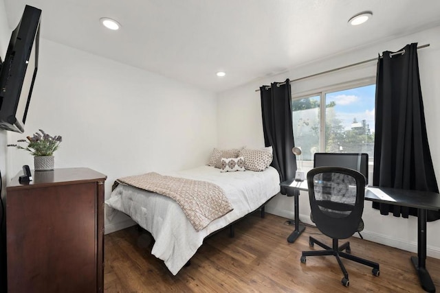 bedroom featuring dark hardwood / wood-style flooring