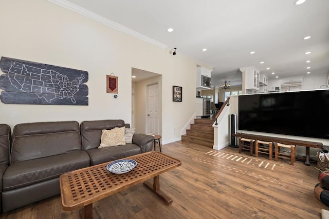 living room with ornamental molding and wood-type flooring