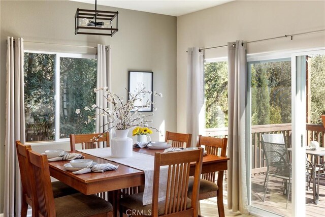 dining area with an inviting chandelier