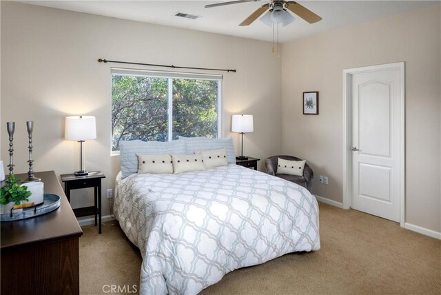 bedroom with ceiling fan and carpet floors