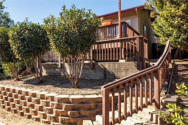 view of side of property featuring a deck