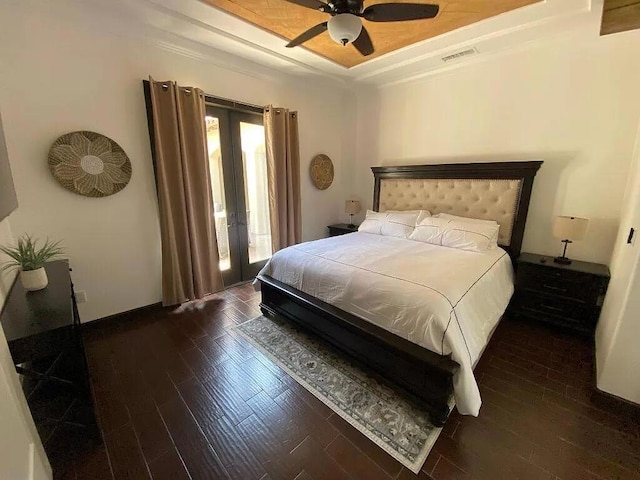 bedroom with ceiling fan and dark hardwood / wood-style floors