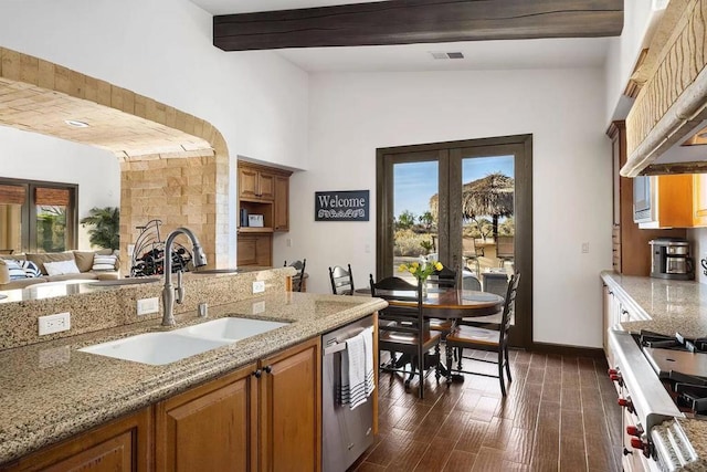 kitchen with sink, stainless steel appliances, dark wood-type flooring, vaulted ceiling with beams, and premium range hood