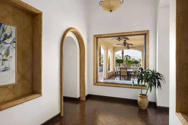 hallway featuring dark parquet floors