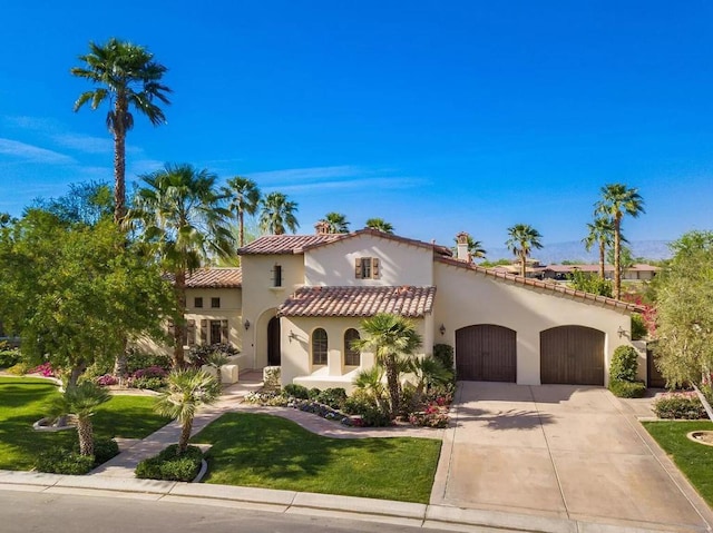 mediterranean / spanish house with a garage