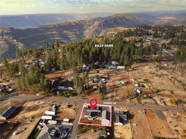 birds eye view of property with a mountain view