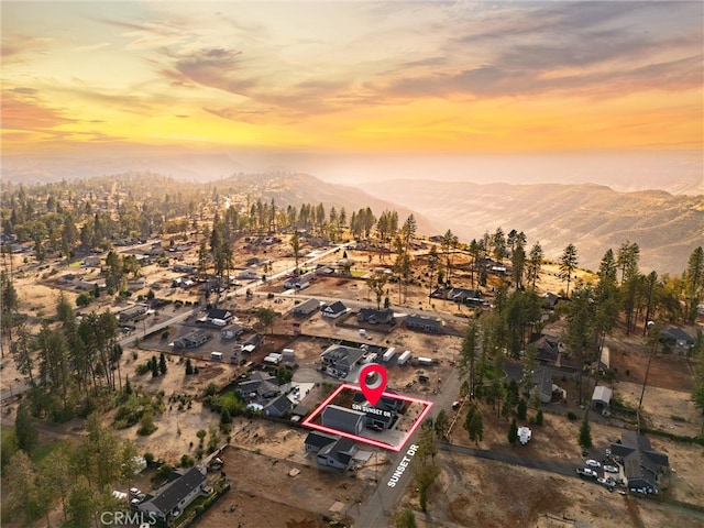 aerial view at dusk with a mountain view