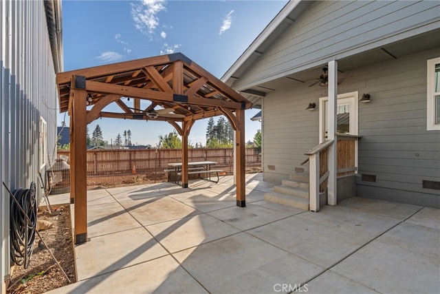 view of patio / terrace featuring a gazebo and ceiling fan