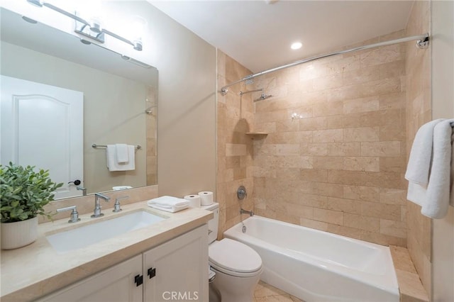 full bathroom with vanity, toilet, and tiled shower / bath